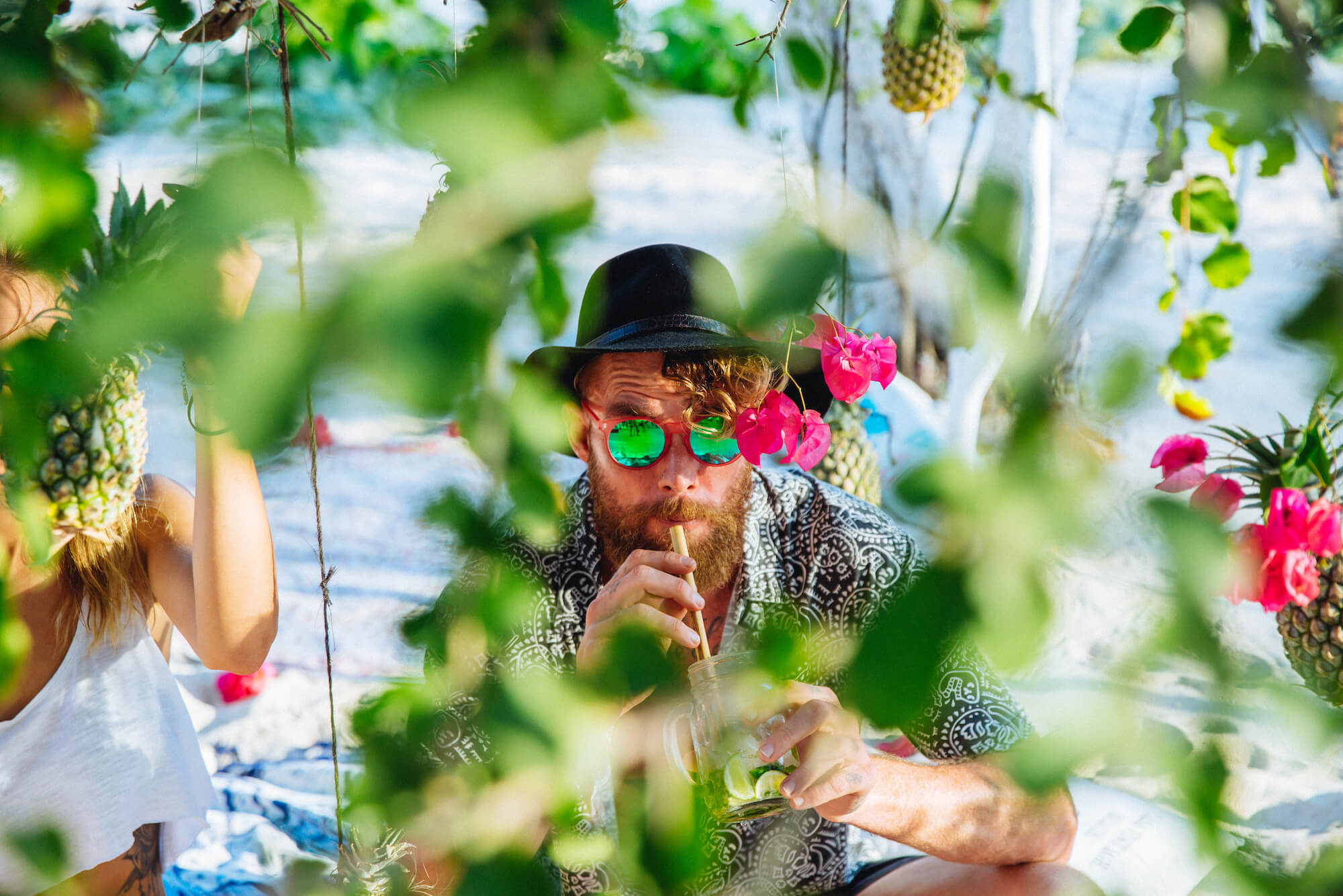 Ash sipping cocktails in the Melon Echo Sunglasses