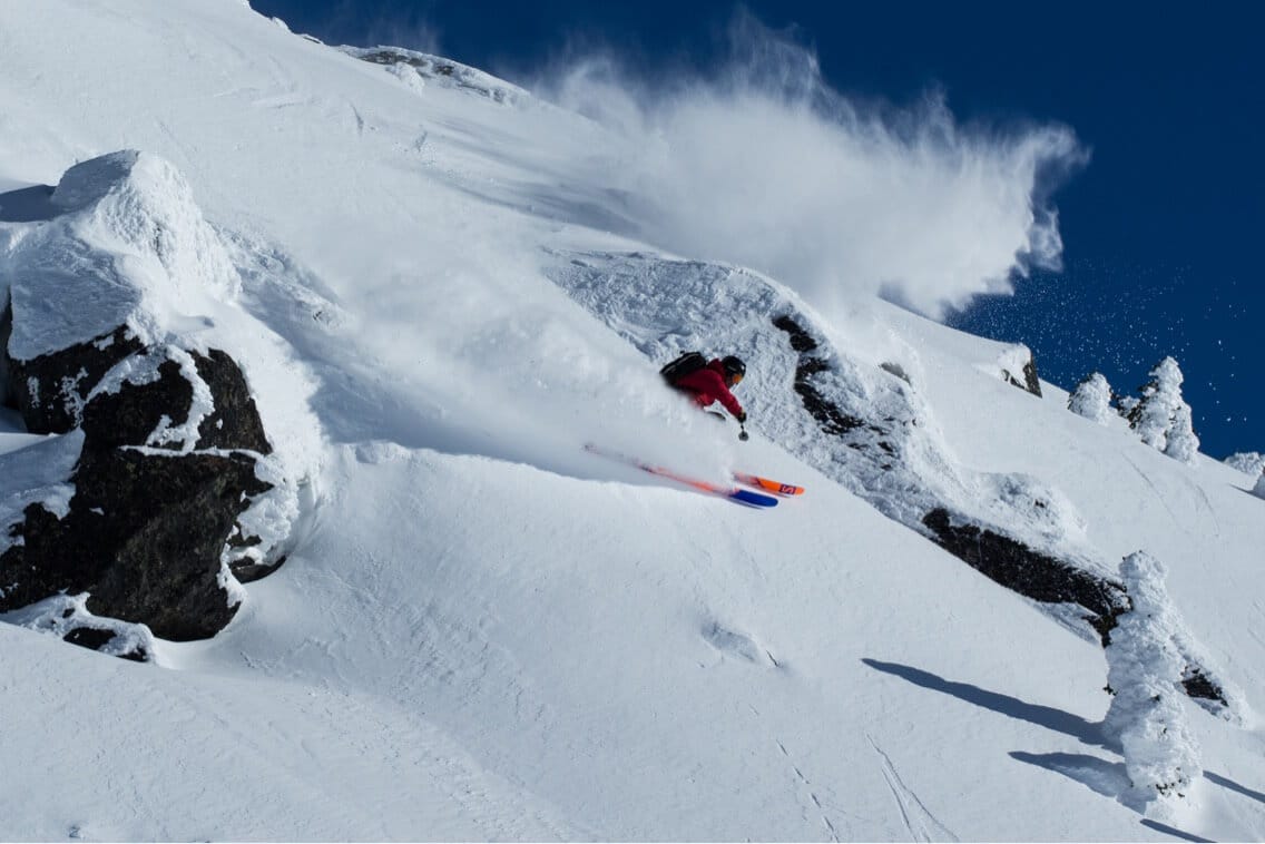 Kieran Nikula deep powder turn in Canada